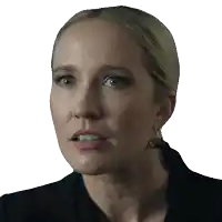 a close up of a woman 's face with a serious look on her face