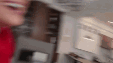 a blurry picture of a person standing in front of a fridge