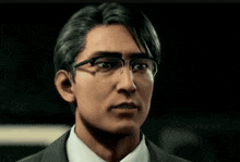 a man wearing glasses and a suit looks serious