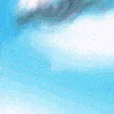 a robot is flying through the air with a blue sky in the background