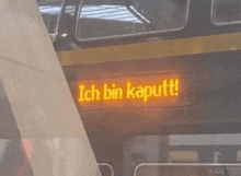 a sign that says ich bin kaputt on a bus
