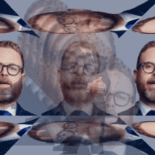 a man with glasses and a beard is surrounded by other people 's faces