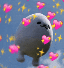 a stuffed animal is surrounded by pink hearts against a blue sky