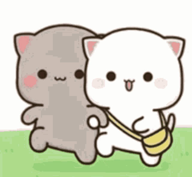 two cats are standing next to each other in the grass . one of the cats is carrying a yellow bag .
