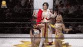 three women in a wrestling ring with the hashtag pw_mg on the screen