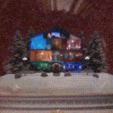 a christmas scene with a stained glass window and trees in front of it