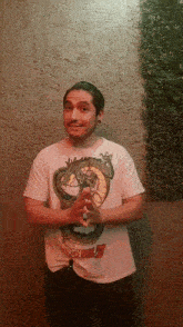 a man wearing a shirt that says dragon ball z on it