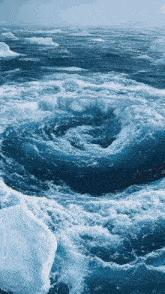 a large body of water with a swirl in the middle of it