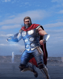 a man in a superhero costume with a red cape is jumping in the air