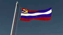 a red white and blue flag with a hammer and sickle on it