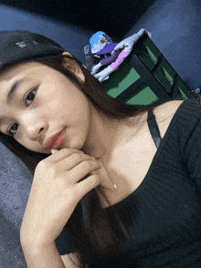 a woman wearing a black hat and a black sweater