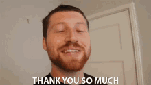 a man with a beard is smiling and saying thank you so much