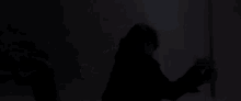 a man with a beard is holding a sword in his hand