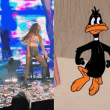 a woman is dancing on stage next to a cartoon character .