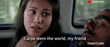 a woman sitting next to a man with the words carpe diem the world my friend above her