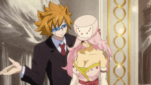 a man in a suit is standing next to a woman in a pink dress