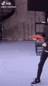 a person holding a frisbee with the number 1158132941 on the bottom left