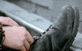 a close up of a person tying their boots with the words arkvgifs tumblr at the bottom