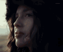 a close up of a woman 's face with the word archives visible