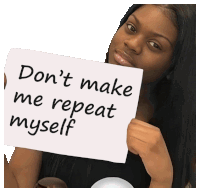 a woman is holding a sign that says " don 't make me repeat myself "