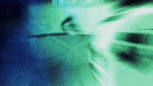 a blurry picture of a person 's face on a blue and green background