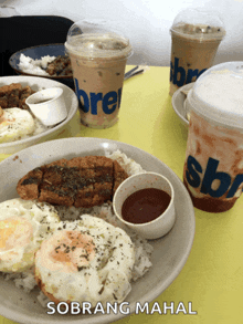 a table topped with plates of food and drinks with sobrang mahal written on the bottom