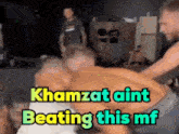 a man laying on a bed with the words " khamzat aint beating this mf "
