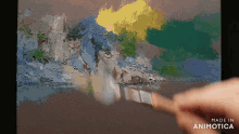 a person is painting on a canvas with a brush and the words made in animotica on the bottom