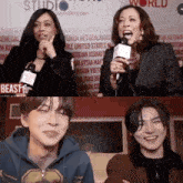 a woman is holding a microphone in front of a sign that says beast on it