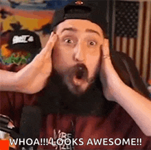 a man with a surprised look on his face is holding his hands to his head and says `` whoa ! ''