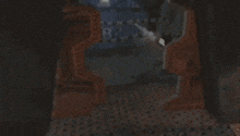 a close up of a metal object with the letter p on it in a dark room