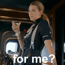 a woman holding a martini glass with the words " for me " on the bottom