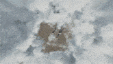 an aerial view of a person standing in the middle of a cloudy area .