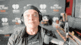 a man wearing headphones and a t-shirt that says " enter into the unknown "