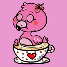 a pink flamingo sits in a cup of coffee with hearts around it