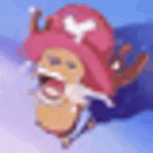 a blurry picture of a person wearing a pink hat .
