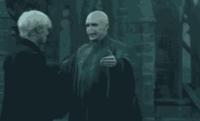 Voldemort Hug Malfoy GIF - Hug Awkward Reunion GIFs