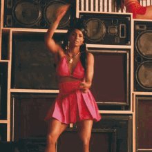 a woman with a bun on her head is flexing her muscles