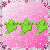a green object is surrounded by pink hearts and glitter