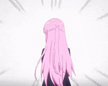 a girl with long pink hair and blue eyes is wearing a black suit and tie .