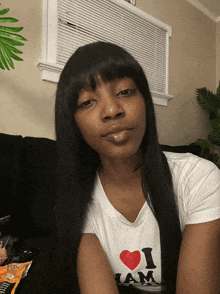 a woman wearing a white t-shirt that says i love jam