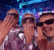a group of people wearing sunglasses and goggles with the word euro on the screen behind them