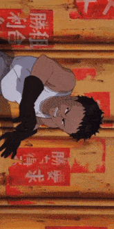 a man in a white shirt is laying on a wooden wall with chinese writing on it