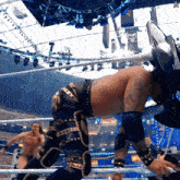 a man in a wrestling ring with the word wrestlemania in the background