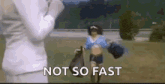a woman in a cheerleader costume is running in a field with the words `` not so fast '' written next to her .