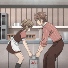 a man and a woman are standing next to a can of asahi beer