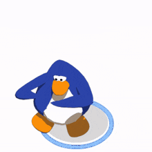 a blue and orange penguin is standing on a white surface
