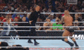 a man in a black shirt is standing in a wrestling ring with a sign that says legend on it