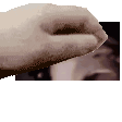 a close up of a person 's hand with a blurred background .
