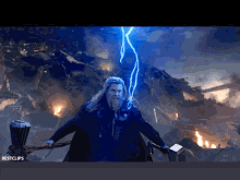 a man with a beard is holding a hammer and a lightning bolt is coming from him